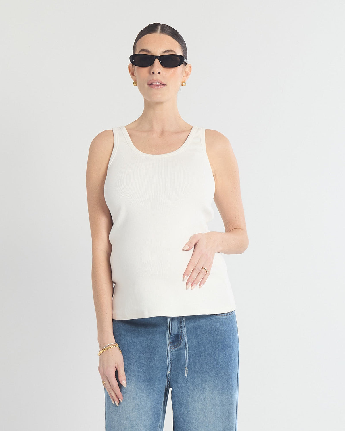 Image of a model wearing Tops. Product name - The All Day Tank in colour by brand - Soon Maternity