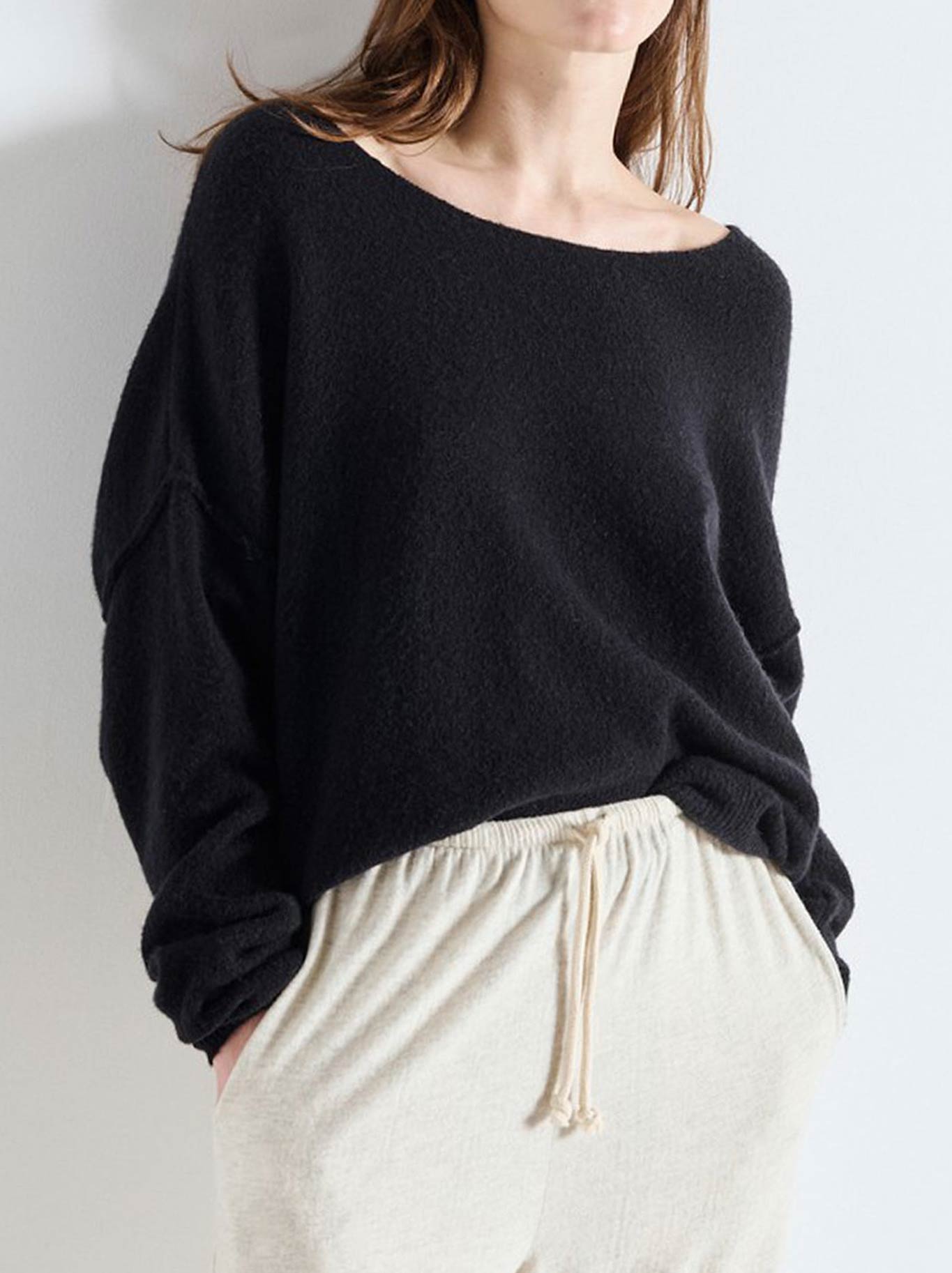Image of a model wearing Outerwear. Productname: AMERICAN VINTAGE DAMSVILLE SLOUCHY BOAT NECK JUMPER in Black colour by brand - American Vintage