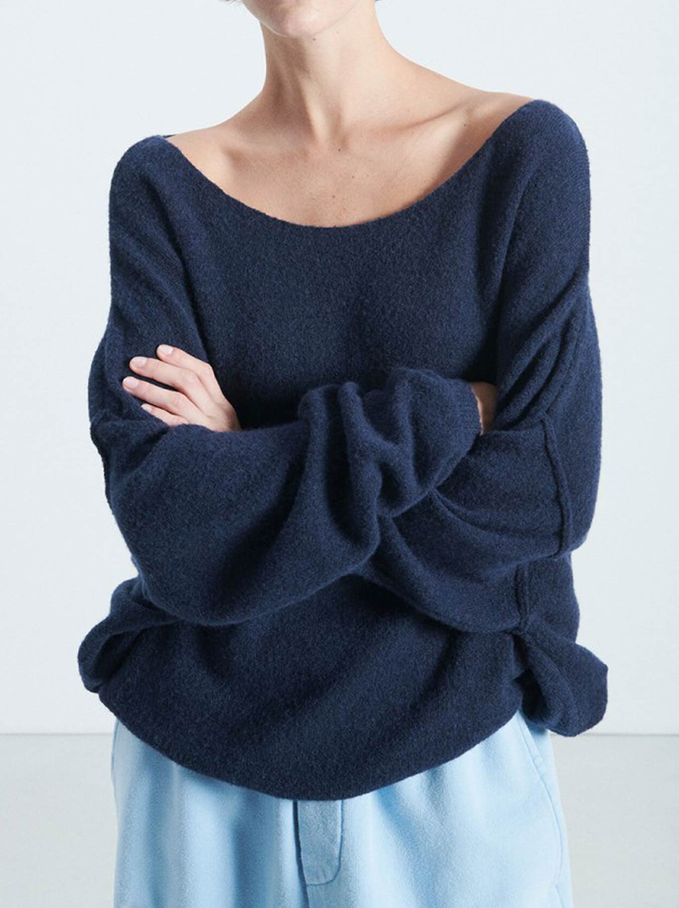 Image of a model wearing Outerwear. Productname: AMERICAN VINTAGE DAMSVILLE SLOUCHY BOAT NECK JUMPER in Navy colour by brand - American Vintage