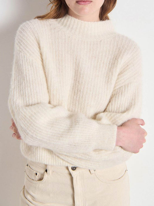 Image of a model wearing Outerwear. Product name - AMERICAN VINTAGE EAST MOCK NECK KNIT in Mother Of Pearl colour by brand - American Vintage