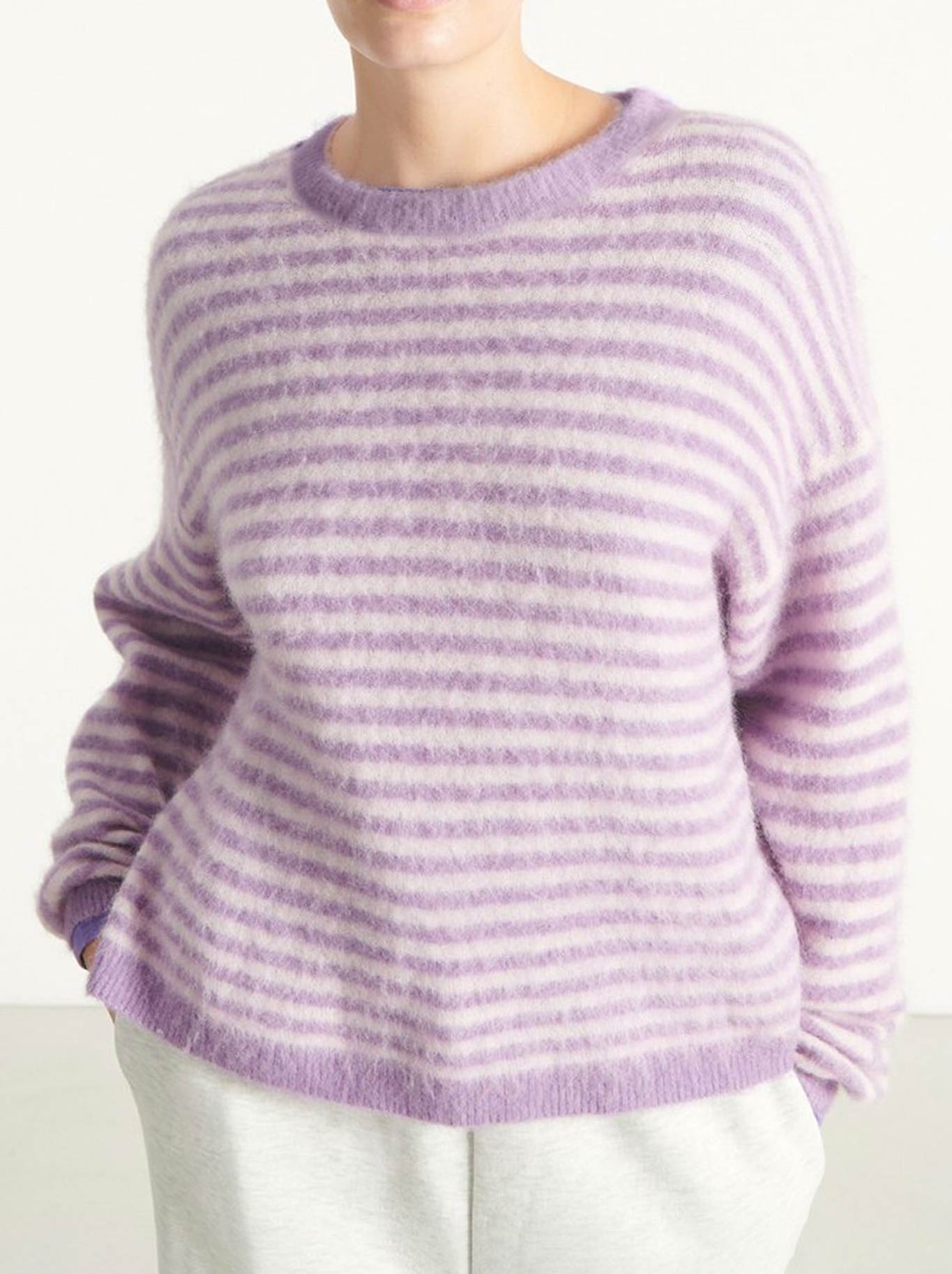 Image of a model wearing Outerwear. Product name - AMERICAN VINTAGE NENYBAY ROUND NECK JUMPER in Violet Stripe Rosebud colour by brand - American Vintage