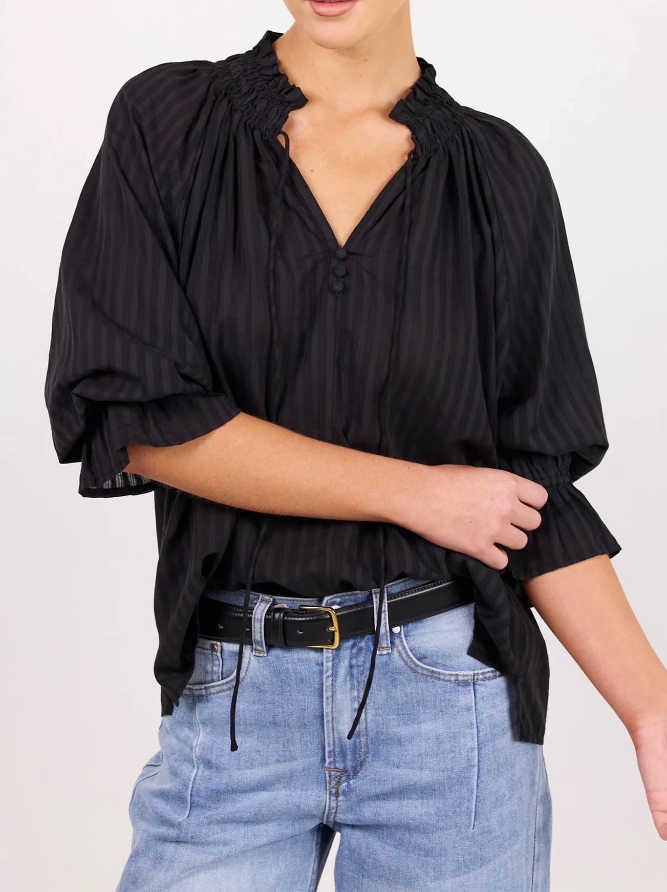 Image of a model wearing Tops. Product name - AMONG THE BRAVE EXPEDITION SHIRRED NECK TOP in Black Stripe colour by brand - Among The Brave