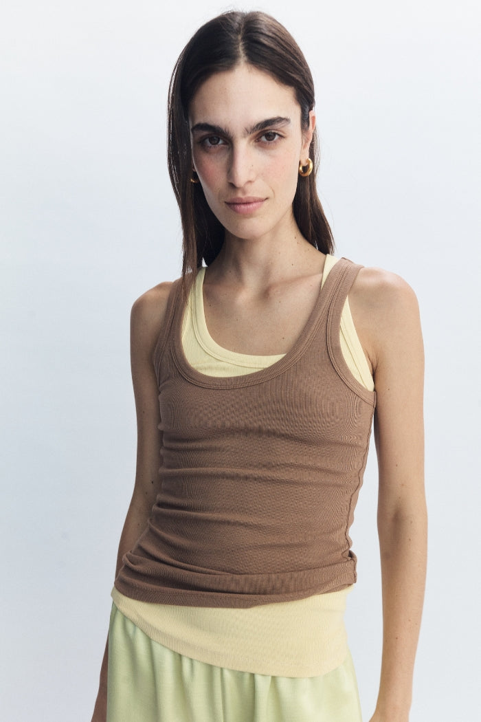 Image of a model wearing Tops. Product name - Antonia Tank Coffee in Coffee colour by brand - Blanca Studio