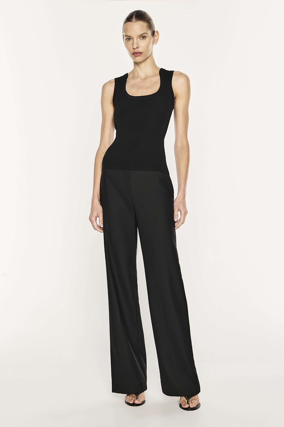Image of a model wearing Tops. Product name - Go Figure Knit Tank in Black colour by brand - MANNING CARTELL