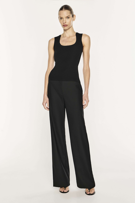 Image of a model wearing Tops. Product name - Go Figure Knit Tank in Black colour by brand - MANNING CARTELL
