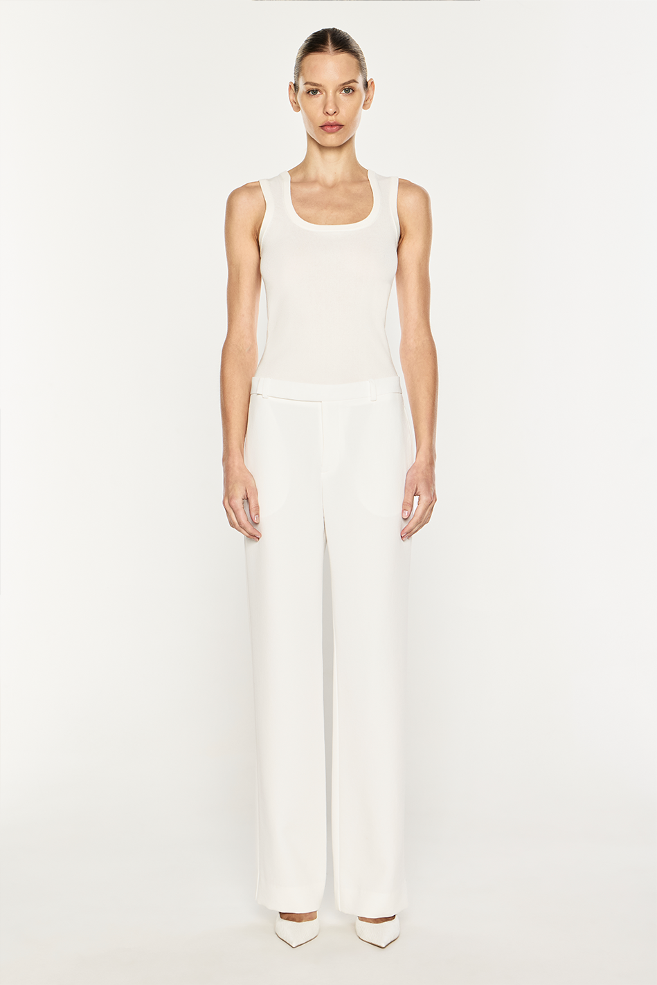 Image of a model wearing Pants. Product name - Modern Master Pant in Chalk colour by brand - MANNING CARTELL