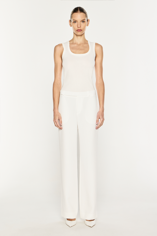 Image of a model wearing Pants. Product name - Modern Master Pant in Chalk colour by brand - MANNING CARTELL