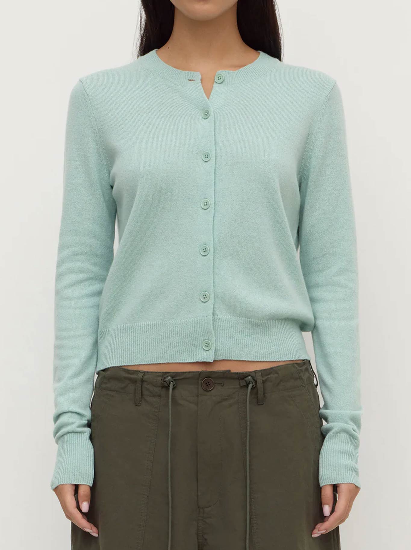 Image of a model wearing Outerwear. Product name - ASSEMBLY LABEL BENNY KNIT CARDIGAN in Mint colour by brand - Assembly Label