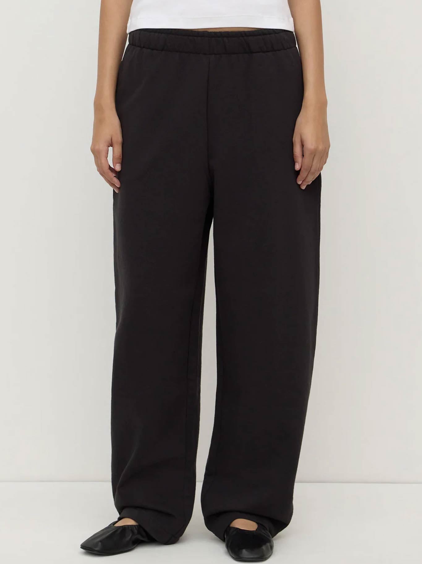 Image of a model wearing Pants. Product name - ASSEMBLY LABEL BRUSHED COTTON LOUNGE PANT in Black colour by brand - Assembly Label