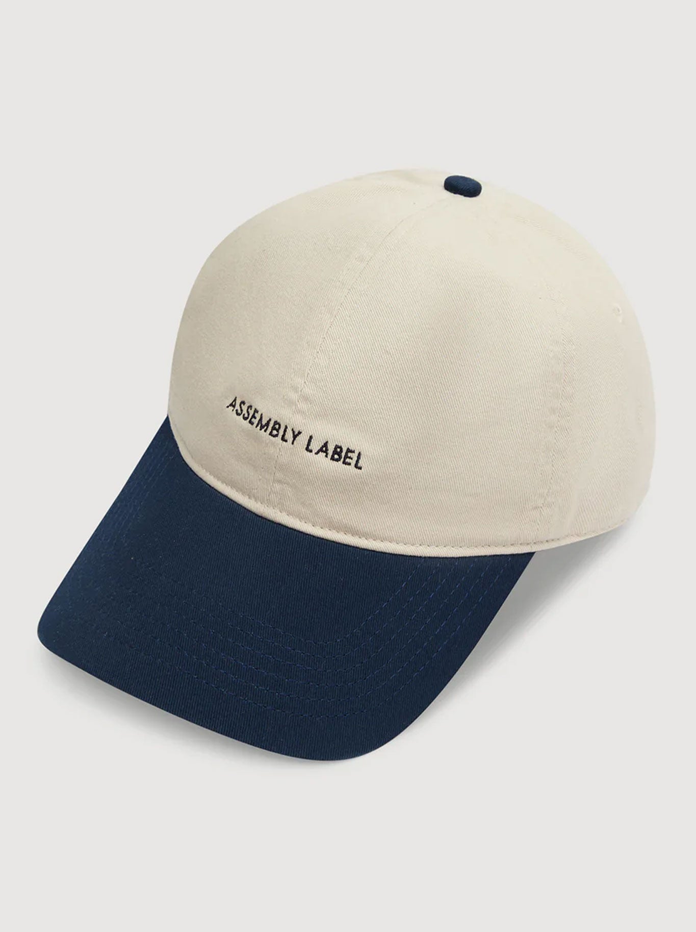 Image of Hats. Productname: ASSEMBLY LABEL CONTRAST CAP in Ecru True Navy colour by brand - Assembly Label