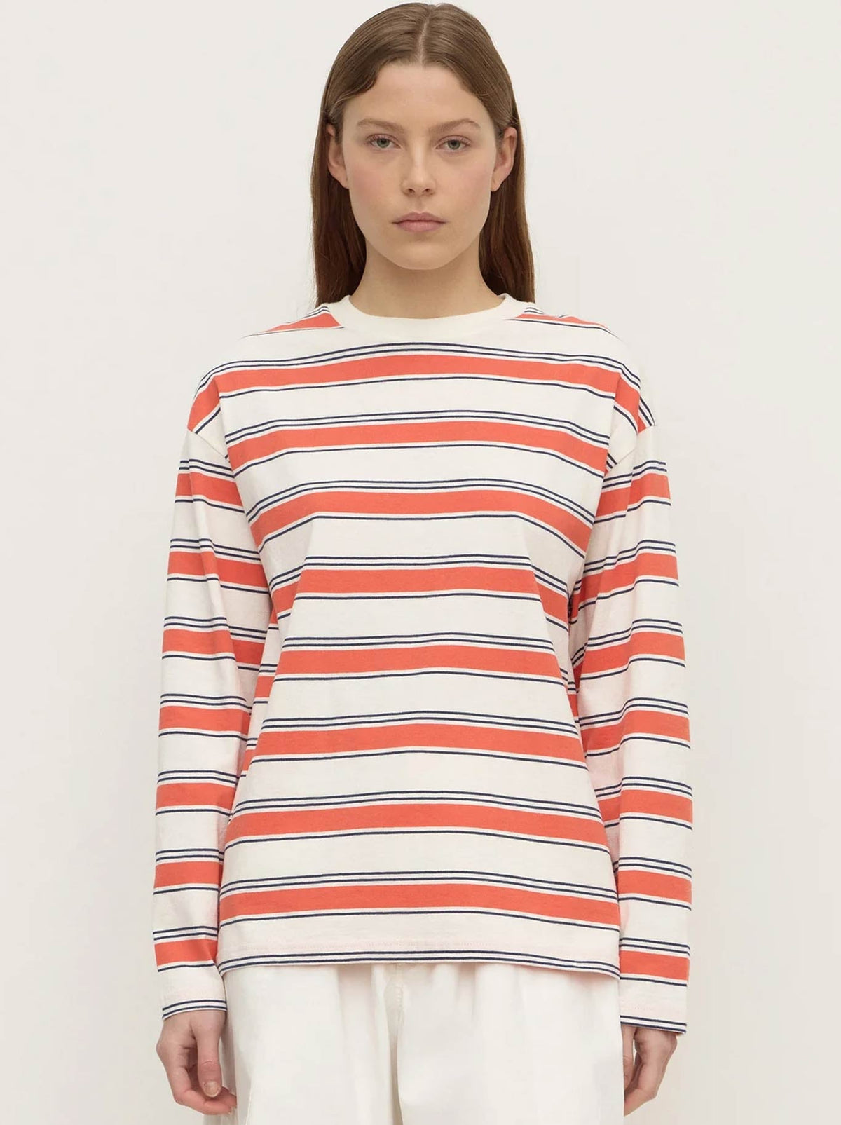Image of a model wearing Tops. Product name - ASSEMBLY LABEL ELIANA STRIPE LONG SLEEVE TEE in Dahlia colour by brand - Assembly Label