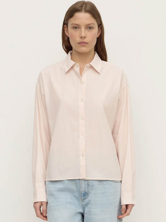 Image of a model wearing Tops. Product name - ASSEMBLY LABEL FRANKIE COTTON LONG SLEEVE SHIRT in Soft Rose colour by brand - Assembly Label