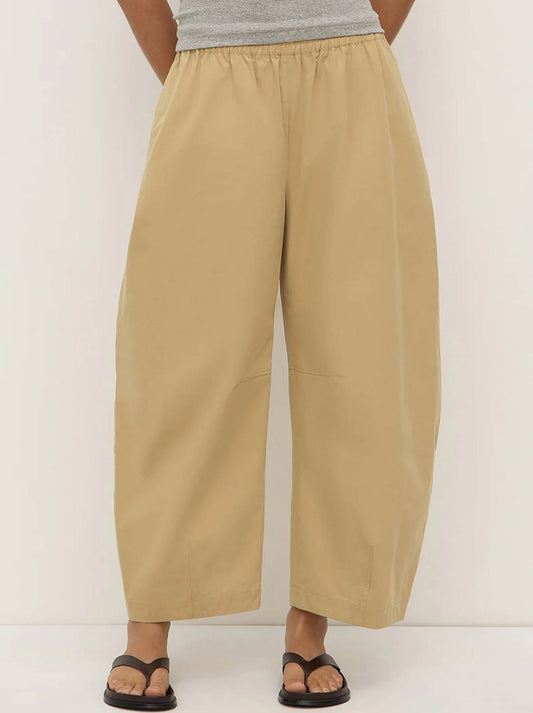 Image of a model wearing Pants. Productname: ASSEMBLY LABEL LOLA BARREL PANT in Tan colour by brand - Assembly Label