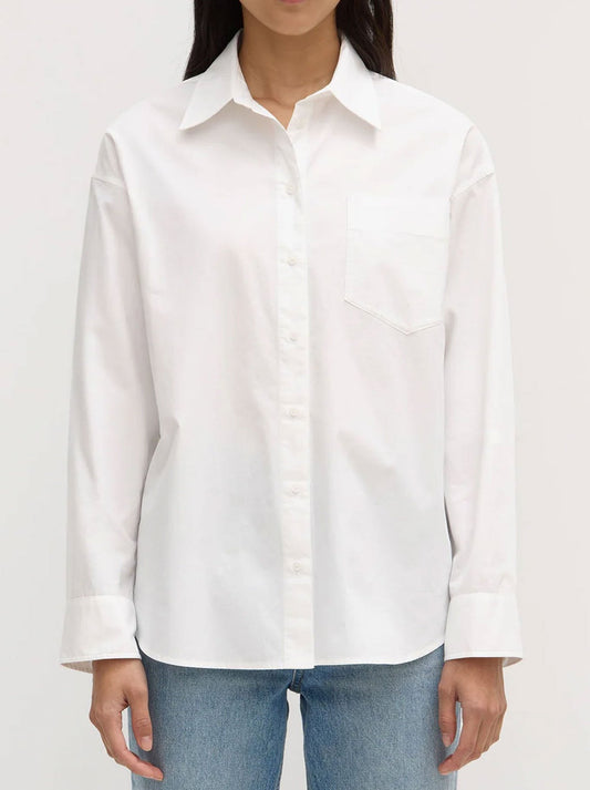 Image of a model wearing Tops. Productname: ASSEMBLY LABEL MOLLY POPLIN LONG SLEEVE SHIRT in White colour by brand - Assembly Label