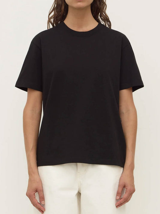 Image of a model wearing Tops. Product name - ASSEMBLY LABEL ORGANIC BASE TEE in Black colour by brand - Assembly Label