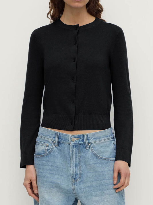 Image of a model wearing Tops. Product name - ASSEMBLY LABEL ORINA COTTON CASHMERE CARDI in Black colour by brand - Assembly Label