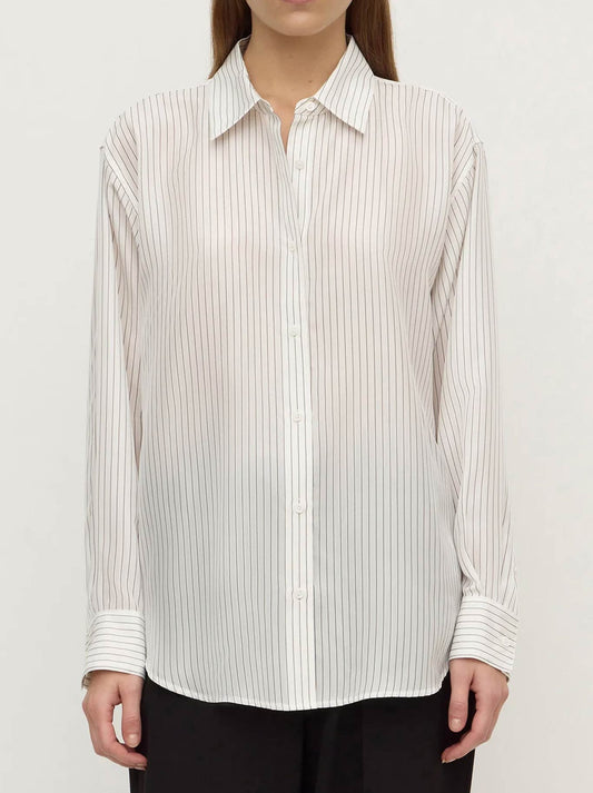Image of a model wearing Tops. Product name - ASSEMBLY LABEL SASKIA SILK SHIRT in Cream colour by brand - Assembly Label
