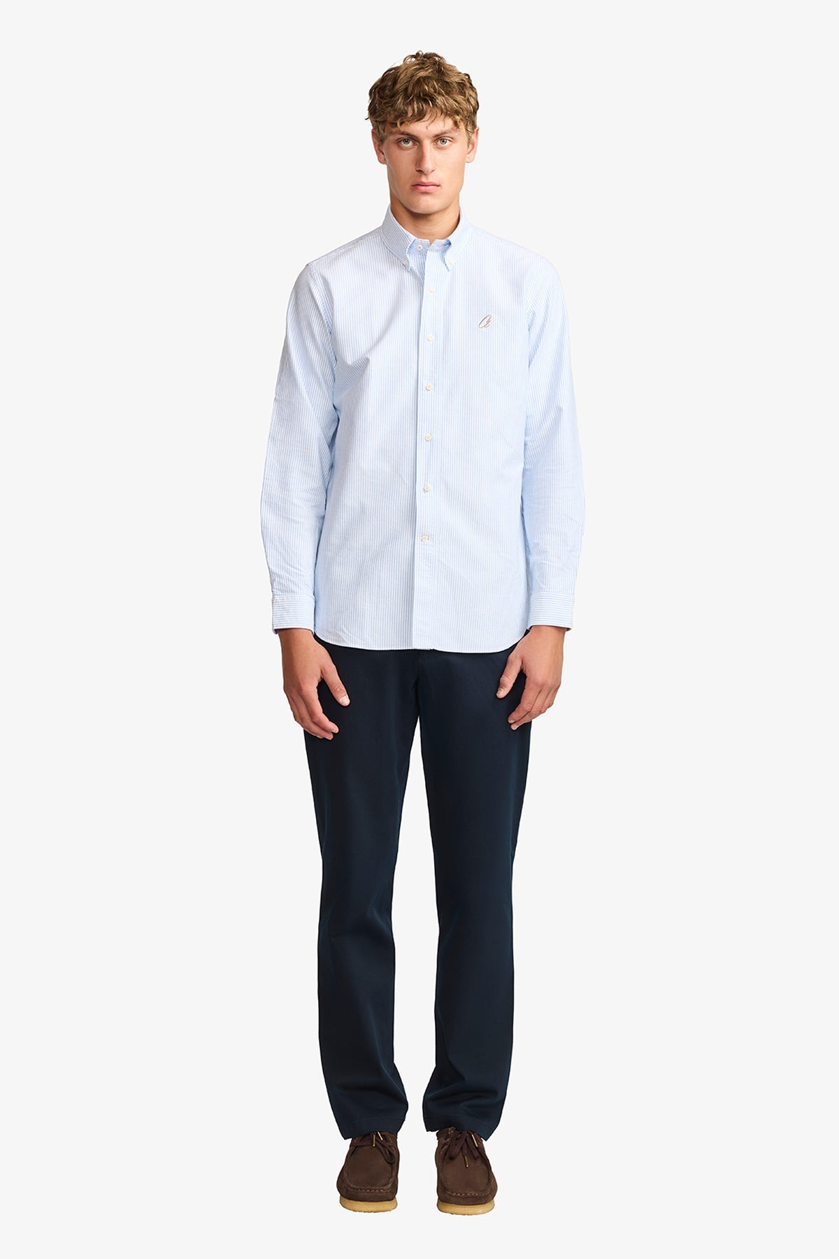 Image of a model wearing Pants. Product name - Austin + Navy Chino in Navy colour by brand - Anthony Squires