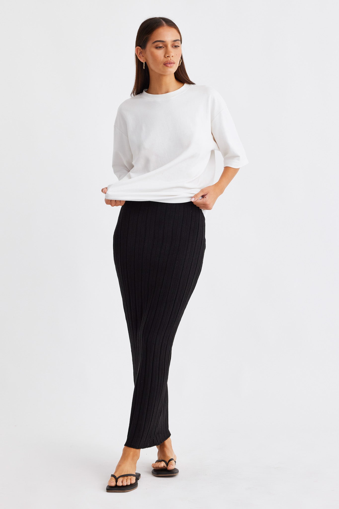 Image of a model wearing Skirts. Productname: SNDYS BAHA MAXI SKIRT in Black colour by brand - SNDYS