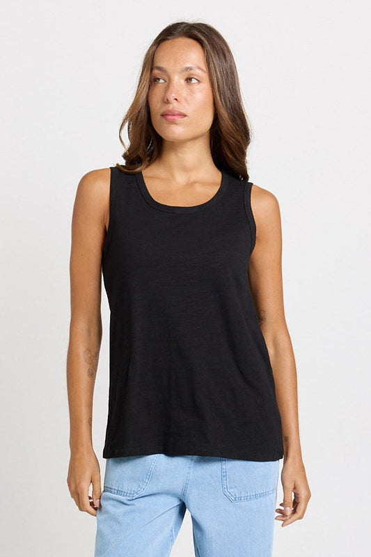 Image of a model wearing Tops. Product name - Rory Cotton Slub Tank Black in Black colour by brand - Betty Basics