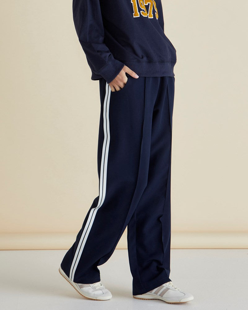 Image of a model wearing Pants. Productname: Betty Basics Maddison Jogger Navy in Navy colour by brand - Betty Basics
