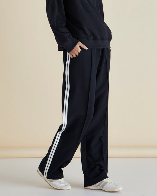 Image of a model wearing Pants. Productname: Betty Basics Maddison Jogger Black in Black colour by brand - Betty Basics