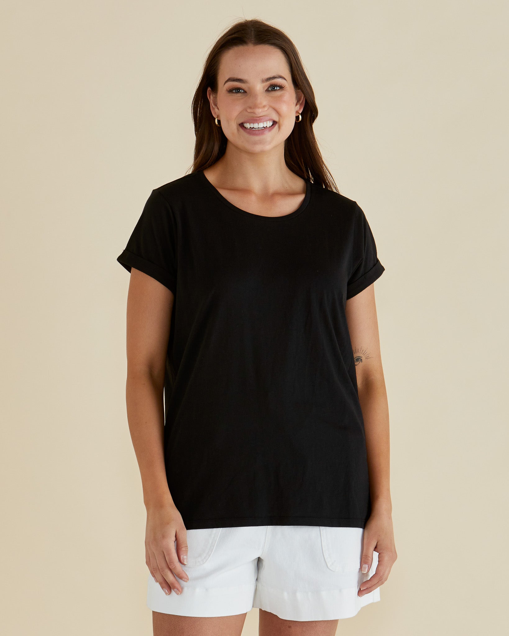Image of a model wearing Tops. Productname: Betty Basics Caia Crew Tee Black in Black colour by brand - Betty Basics