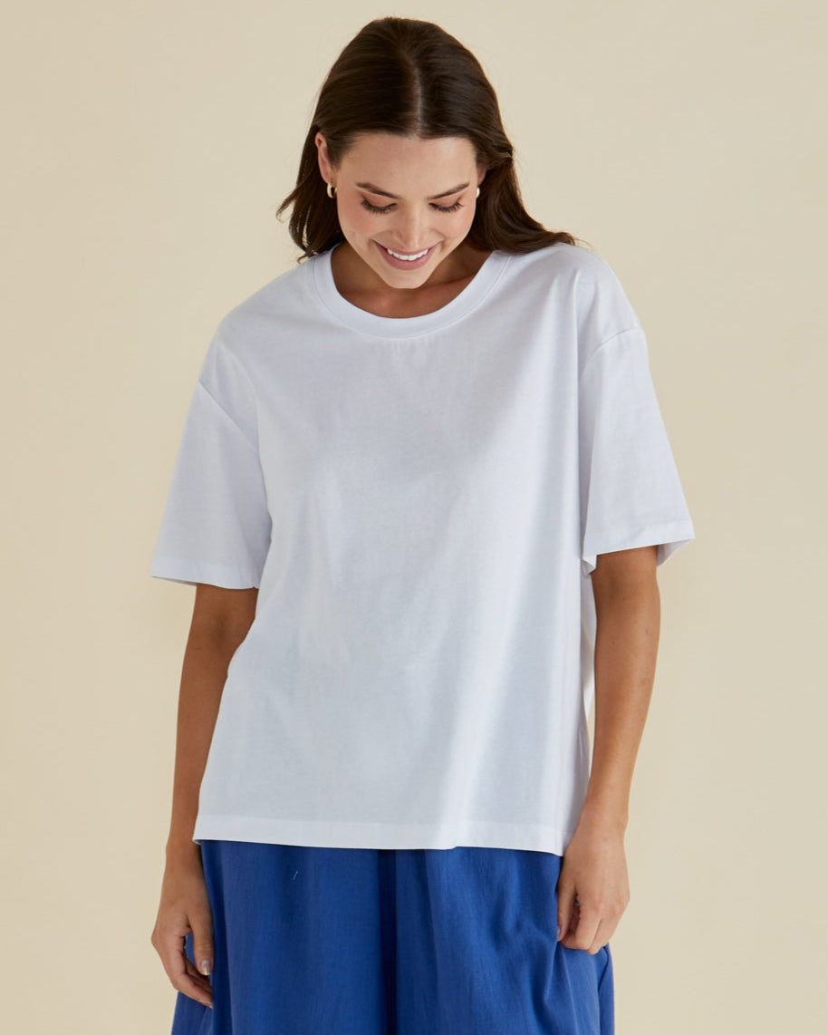 Image of a model wearing Tops. Productname: Betty Basics Relax Boxy Tee White in White colour by brand - Betty Basics