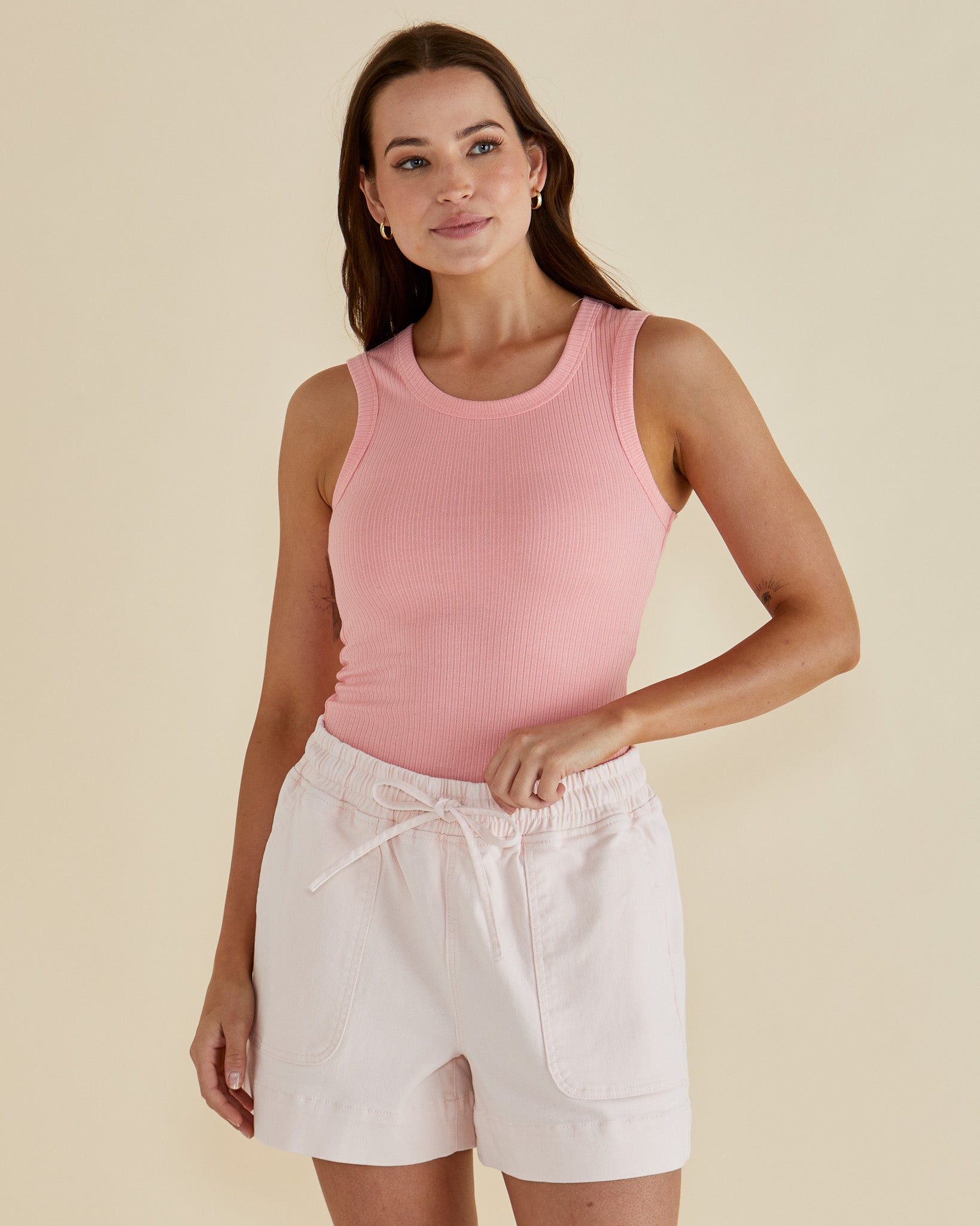 Image of a model wearing Tops. Productname: Betty Basics Francis Rib Tank Peach in Peach colour by brand - Betty Basics