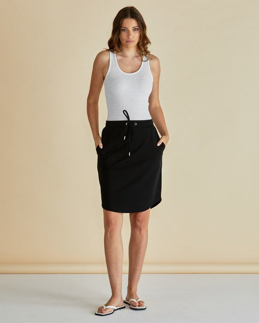 Image of a model wearing Skirts. Productname: Betty Basics Retreat Skirt Black in Black colour by brand - Betty Basics