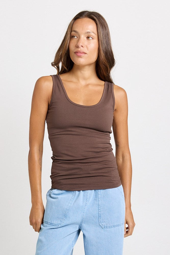 Image of a model wearing Tops. Product name - Emma Scoop Tank in Chocolate colour by brand - Betty Basics