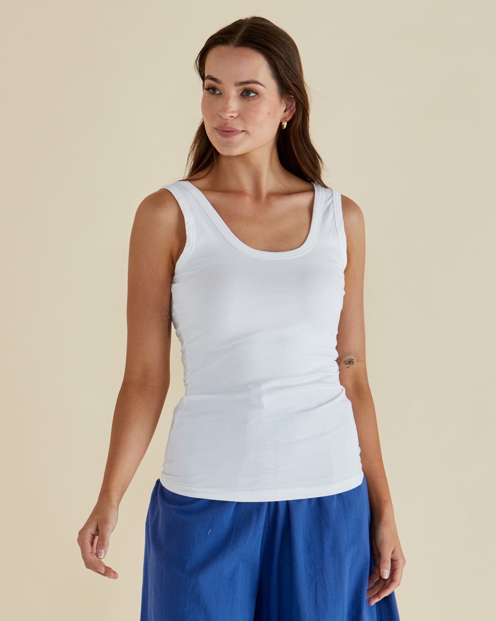 Image of a model wearing Tops. Productname: Betty Basics Emma Scoop Tank White in White colour by brand - Betty Basics