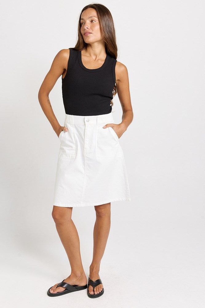 Image of a model wearing Skirts. Product name - Aida A-Line Denim Skirt White in White colour by brand - Betty Basics
