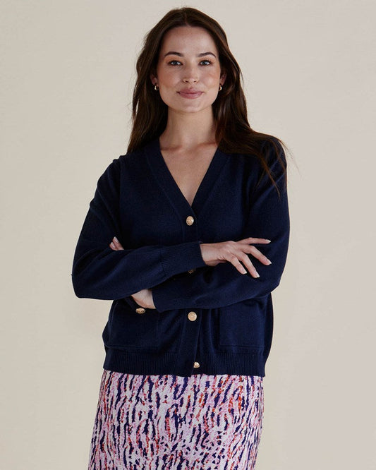 Image of a model wearing Outerwear. Productname: Betty Basics Leon Knit Cardigan Navy in Navy colour by brand - Betty Basics