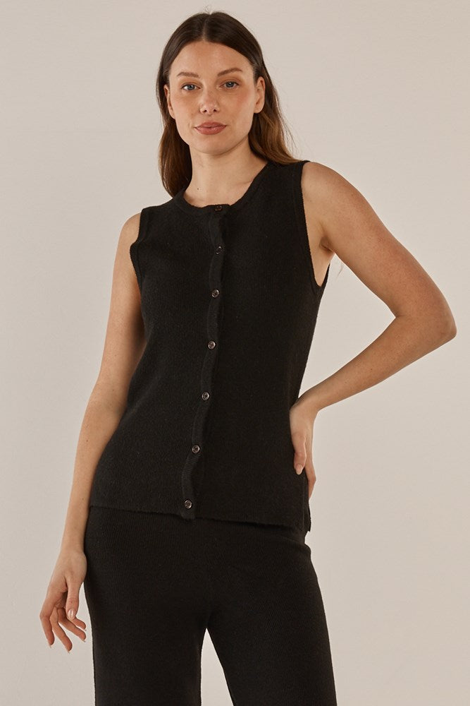 Image of a model wearing Tops. Product name - Shona Knit Vest Black in Black colour by brand - Betty Basics