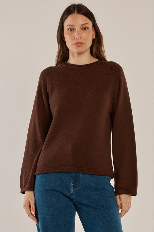 Image of a model wearing Outerwear. Product name - Carrie Knit Jumper Espresso in Espresso colour by brand - Betty Basics