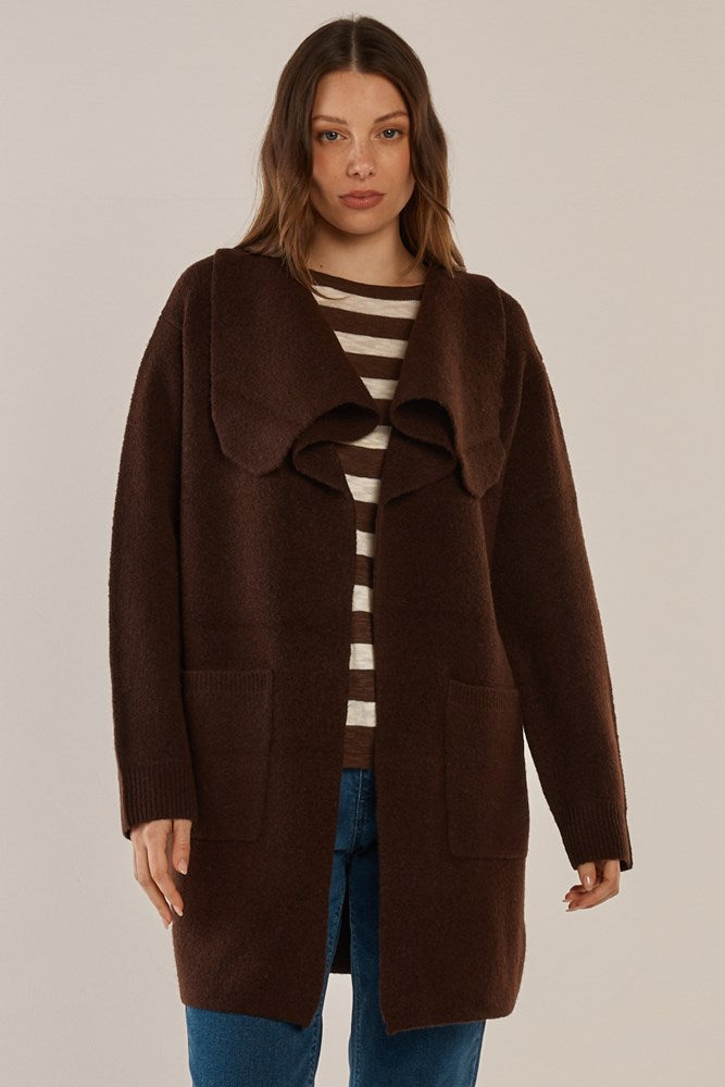 Image of a model wearing Outerwear. Product name - Abigail Cardigan Chocolate in Chocolate colour by brand - Betty Basics