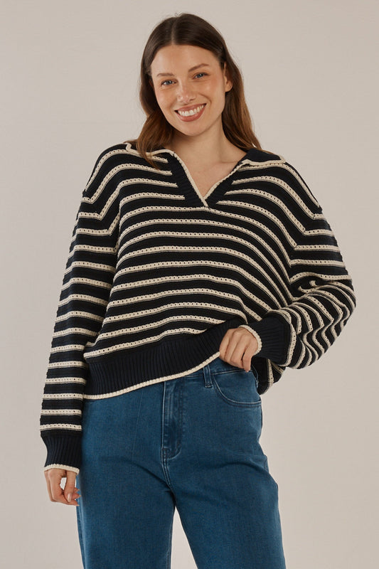 Image of a model wearing Outerwear. Productname: Aberdeen Polo Knit Sweater Navy Stripe in Navy Stripe colour by brand - Betty Basics