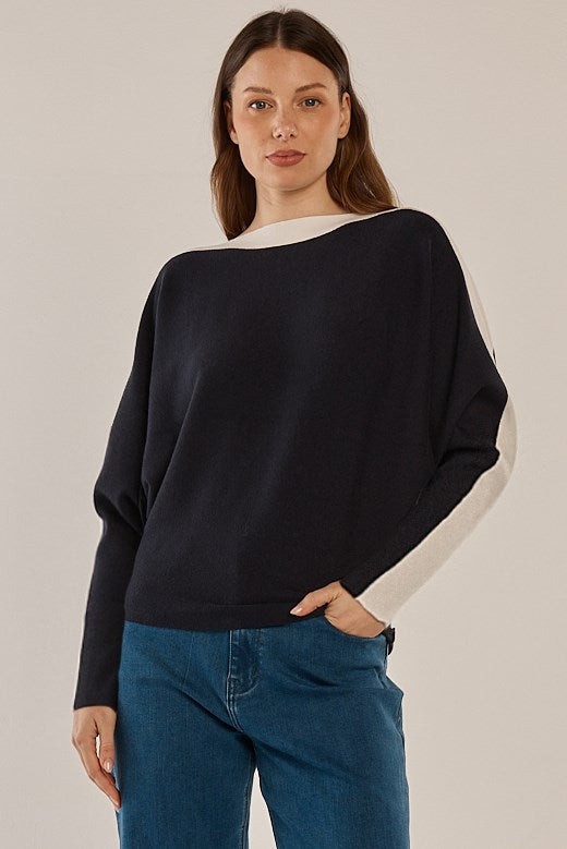 Image of a model wearing Outerwear. Product name - Boatneck Knit Jumper Navy in Navy colour by brand - Betty Basics