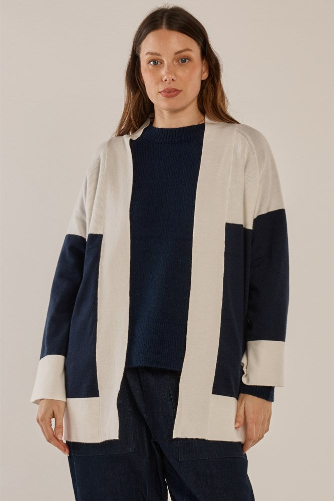 Image of a model wearing Outerwear. Product name - Chase Cardigan Navy/Cream in Navy/Cream colour by brand - Betty Basics
