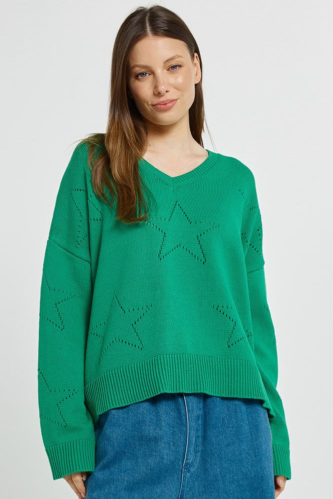 Image of a model wearing Outerwear. Product name - Selene Star Sweater Green in Green colour by brand - Betty Basics