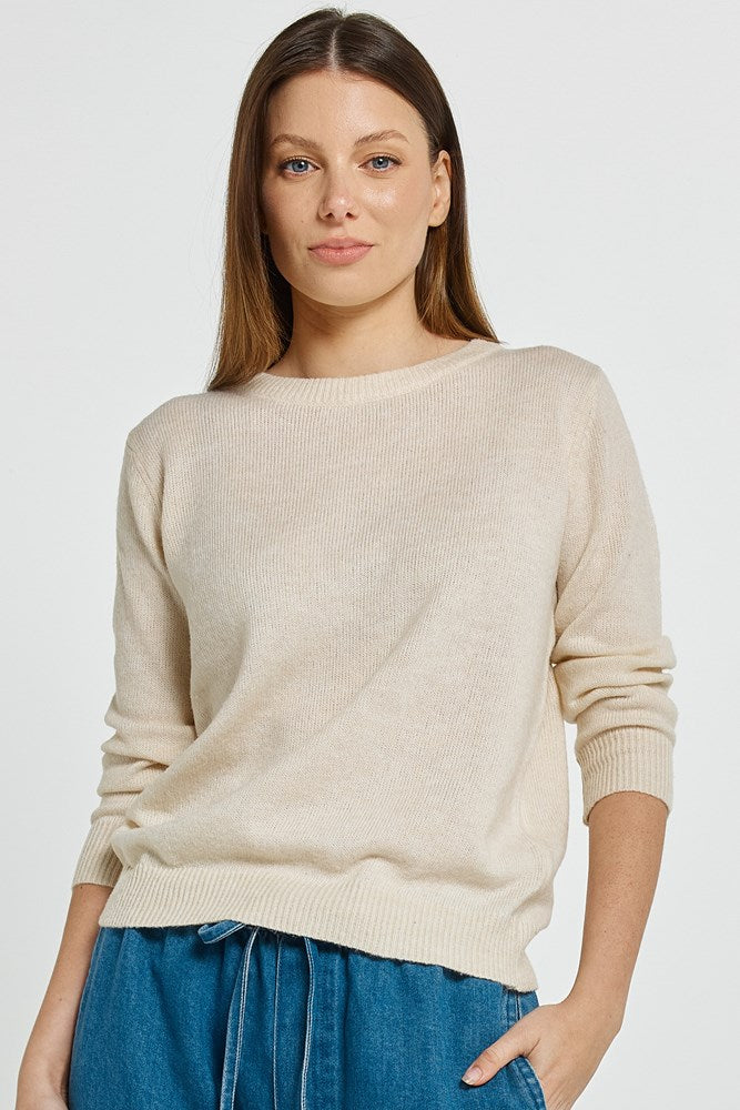 Image of a model wearing Outerwear. Product name - Morris Sweater Cream in Cream colour by brand - Betty Basics