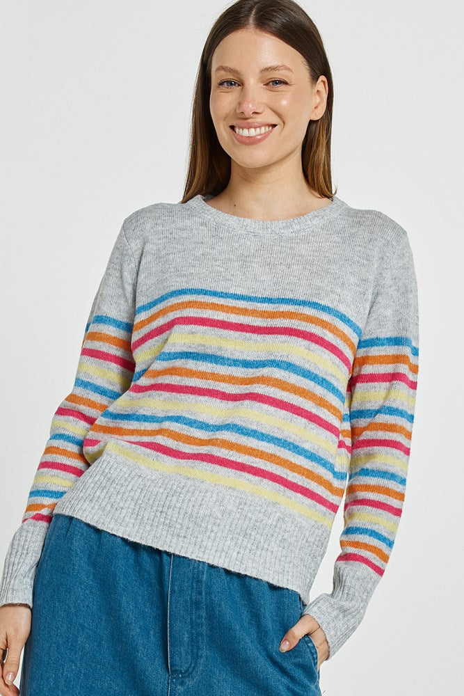 Image of a model wearing Outerwear. Product name - Elinda Sweater Rainbow Stripe in Rainbow Stripe colour by brand - Betty Basics