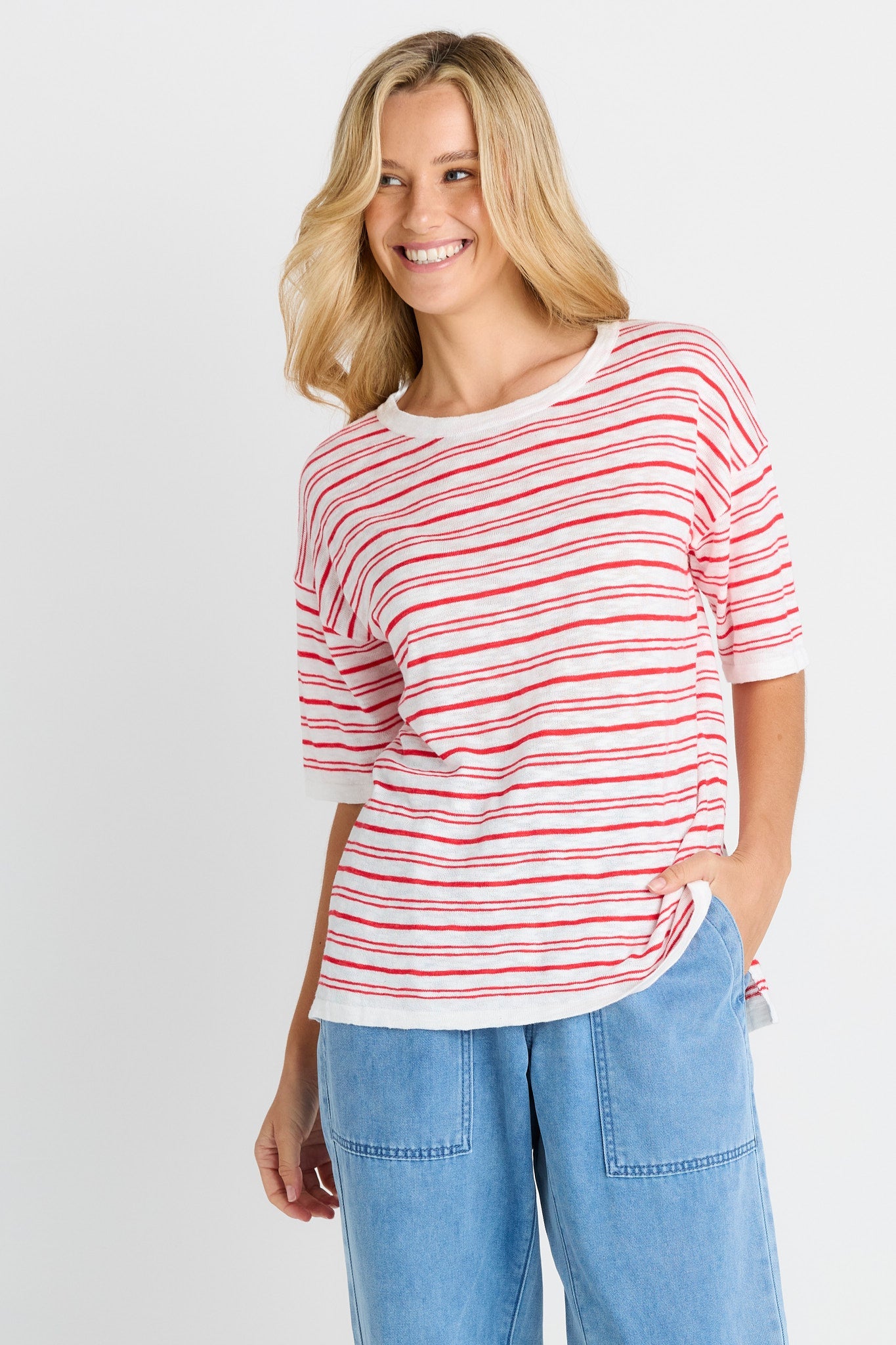 Image of a model wearing Tops. Product name - Eleni Knit Tee in Red/White Stripe colour by brand - Betty Basics