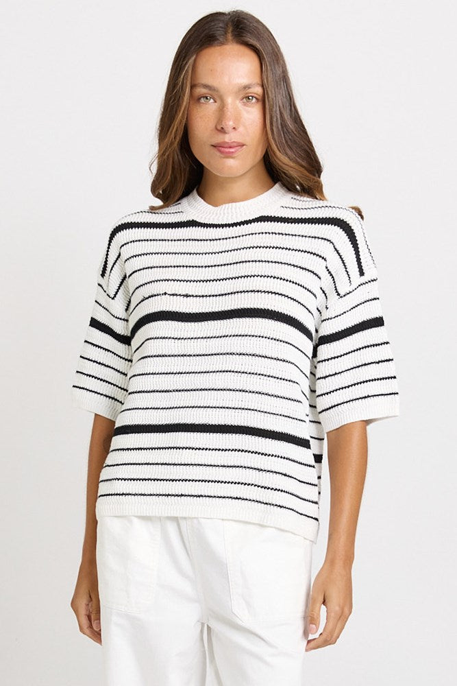 Image of a model wearing Tops. Product name - Dylan Knit Tee White/Black Stripe in White/Black Stripe colour by brand - Betty Basics
