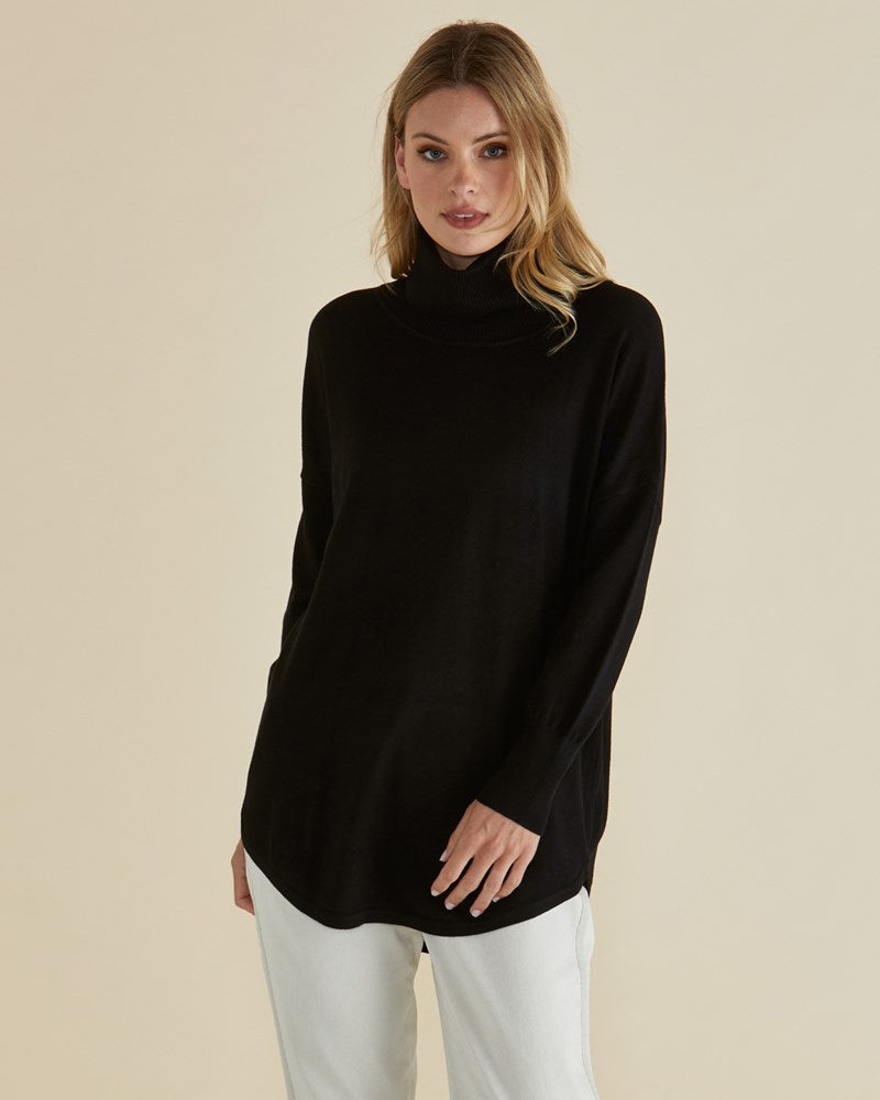 Image of a model wearing Outerwear. Productname: Betty Basics Fleur Roll Neck Jumper in Dark Blue colour by brand - Betty Basics