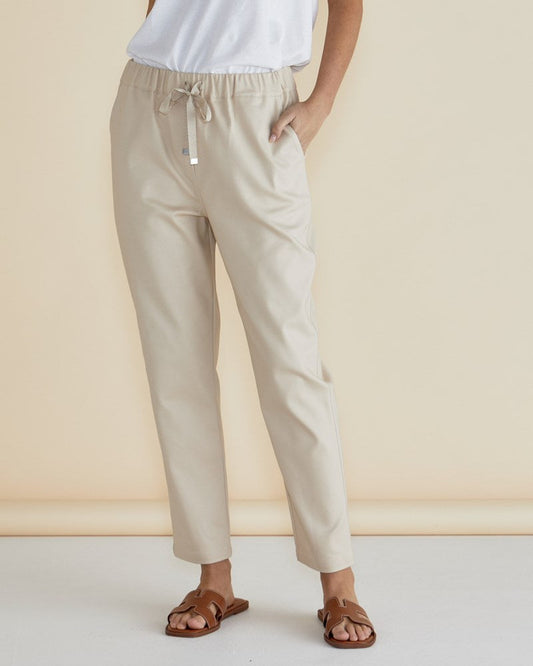 Image of a model wearing Pants. Productname: Betty Basics Kenzie Jogger Cream in Cream colour by brand - Betty Basics