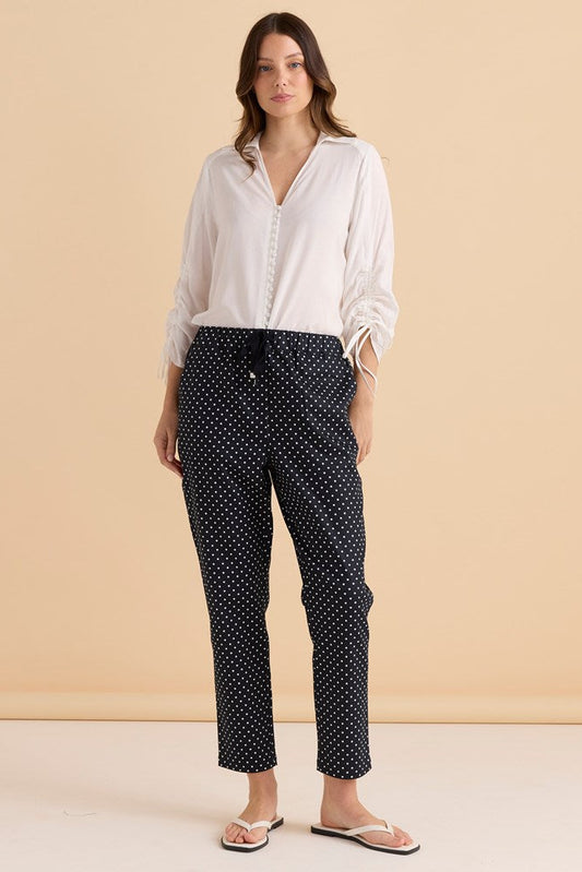 Image of a model wearing Pants. Productname: Betty Basics Kenzie Jogger Navy Polkadot in Navy Polkadot colour by brand - Betty Basics
