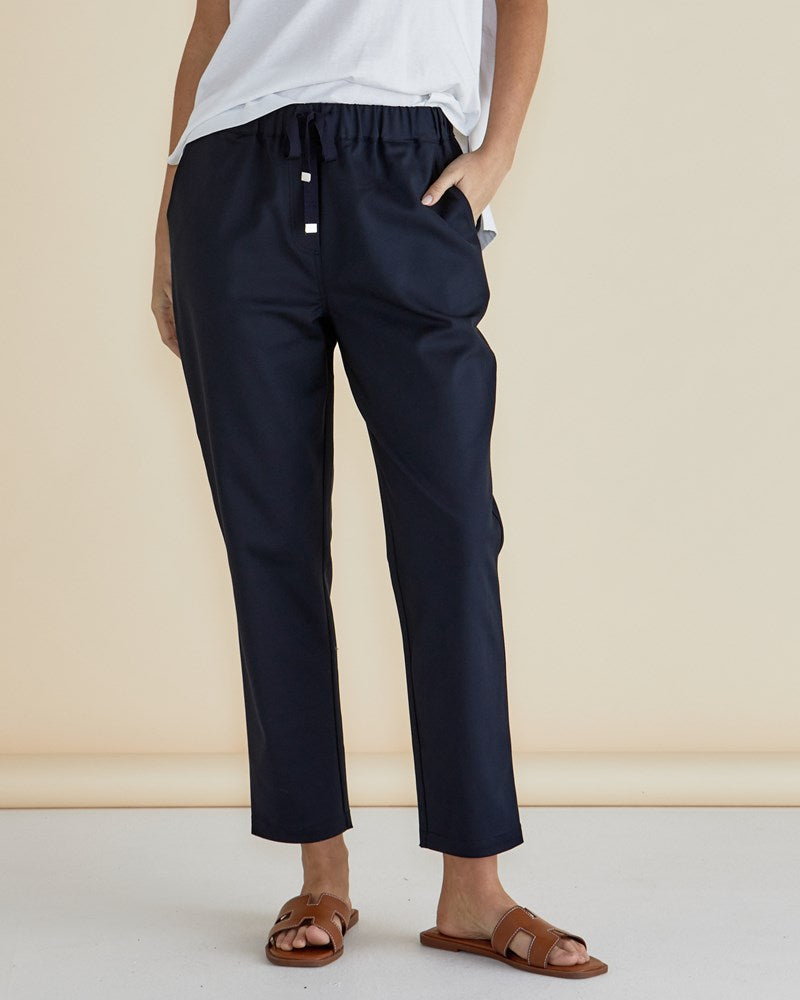 Image of a model wearing Pants. Productname: Betty Basics Kenzie Jogger Navy in Navy colour by brand - Betty Basics