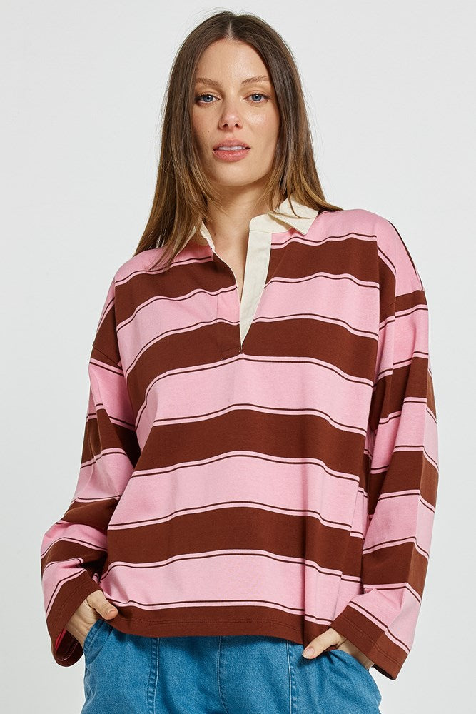 Image of a model wearing Tops. Product name - Roland Rugby Top Pink/Choc in Pink/Choc colour by brand - Betty Basics
